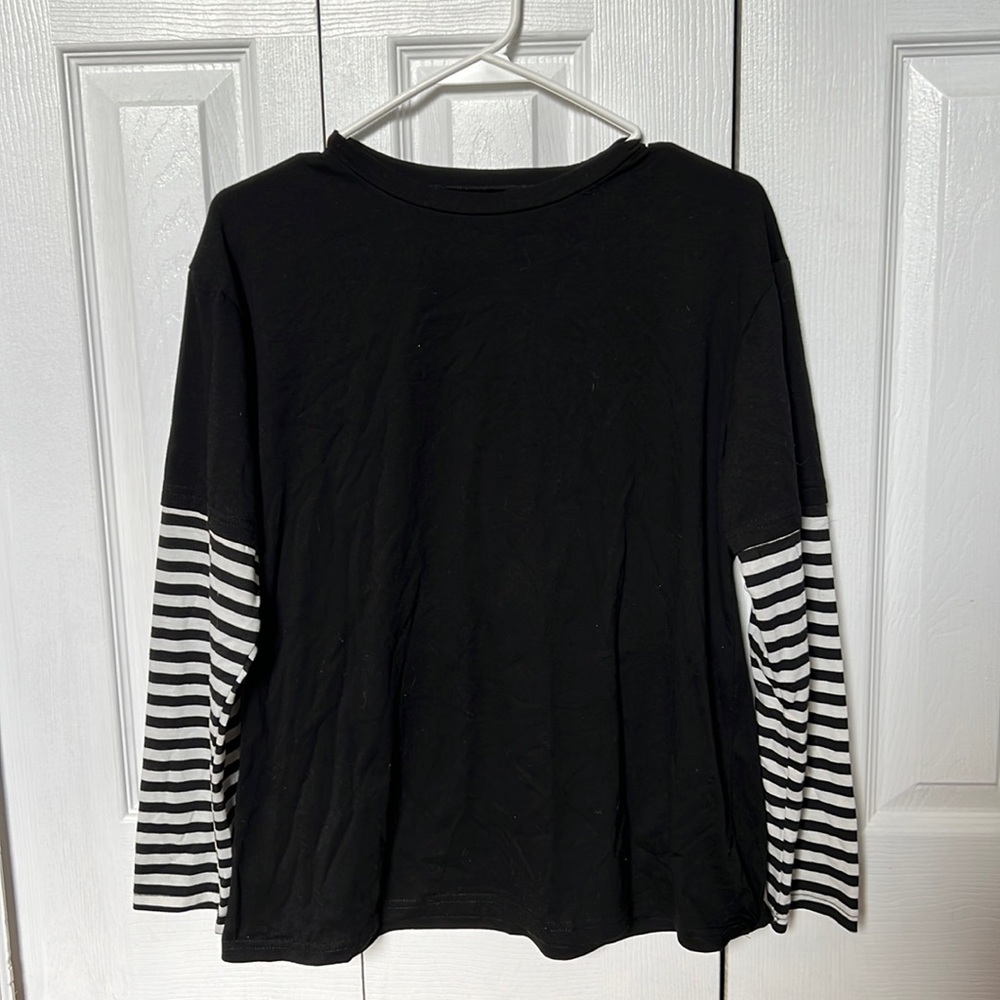 New black and white stripped, long sleeve shirt.